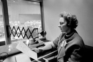 Highly skilled interpreters perform a vital service at UN meetings, where delegates come together to present their views in one of the six official languages or in their own tongue. A UN Interpreter, at work in a booth over looking a meeting room. (1965) UN Photo