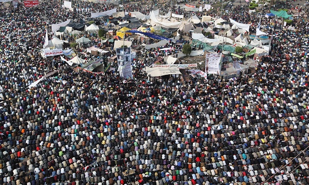 People take part in Friday prayers in Tahrir Square before a mass rally on 25 November 2011 ahead of parliamentary elections. Photograph: Peter Macdiarmid/Getty Images